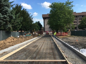 Preparations are being made to pour concrete for a sidewalk leading to Bird Library. This is one of the many construction projects happening on the Syracuse University campus over the summer.